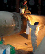 Working on a section of the pipe in the labyrinth beneath the reservoir